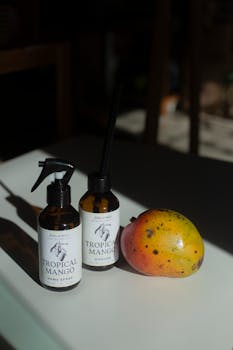 Aromatic tropical mango products with fresh mango on a table in natural light.